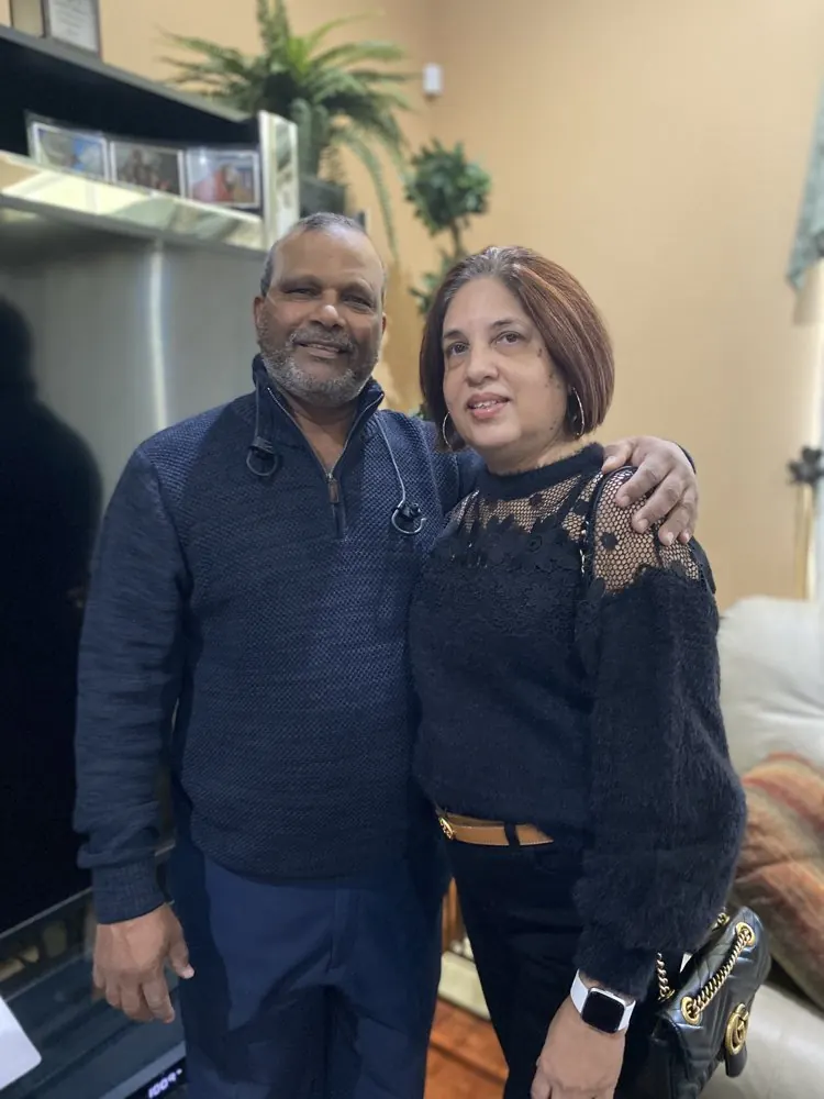 Kris Persaud and his wife at an evening event