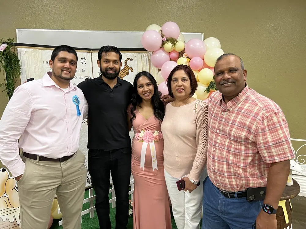 Kris Persaud with family at a celebration